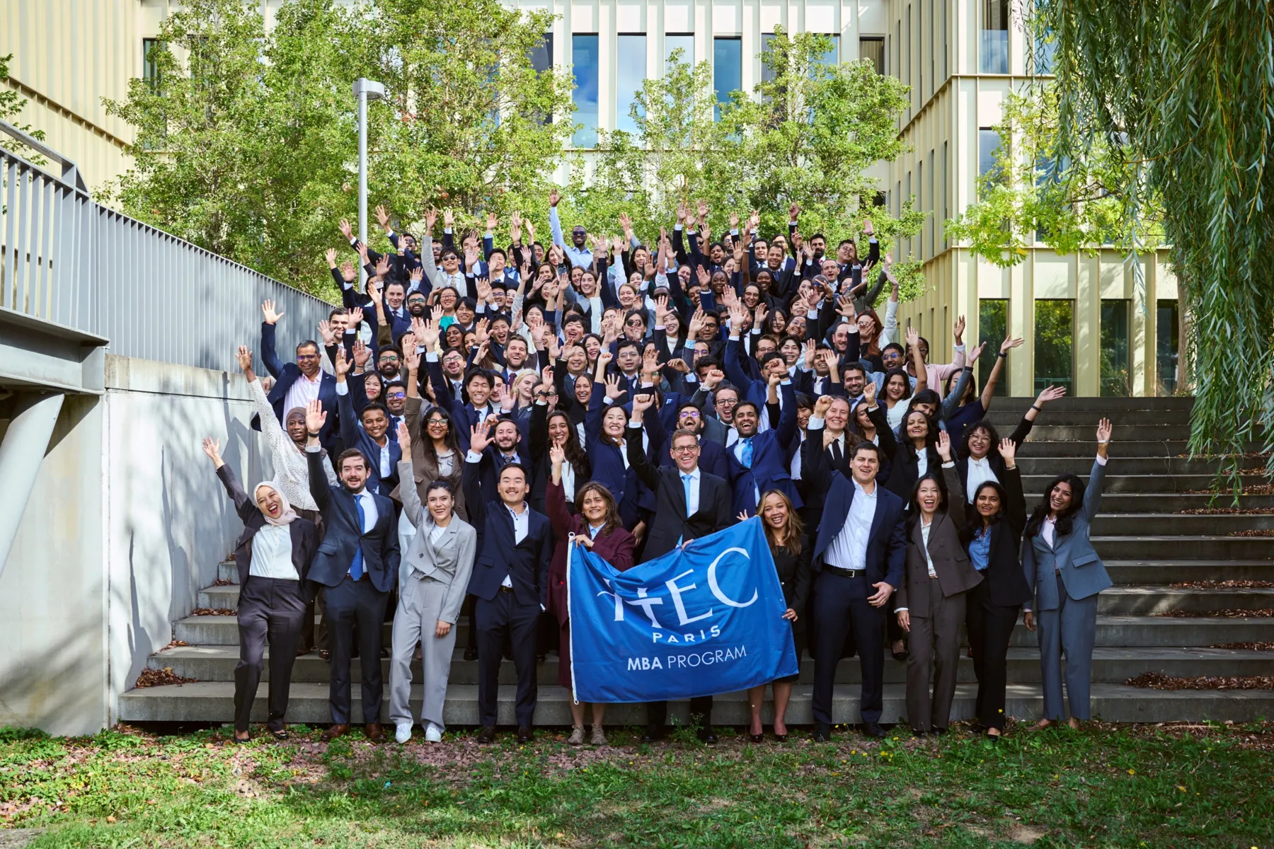 The class, on the steps of the HEC campus